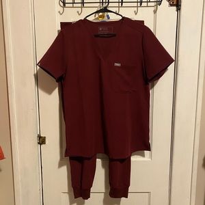 FIGS burgundy jogger pants and matching top scrubs with gray detail